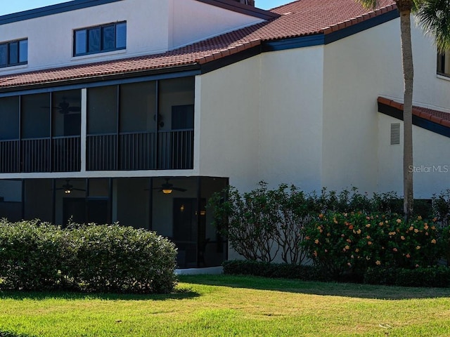 rear view of property with a lawn