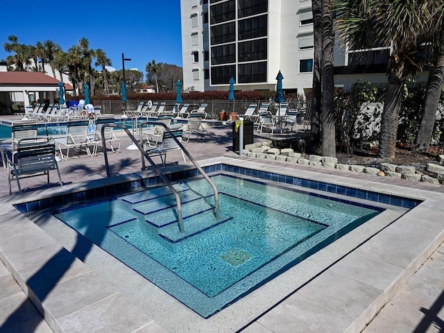 view of swimming pool with a patio area