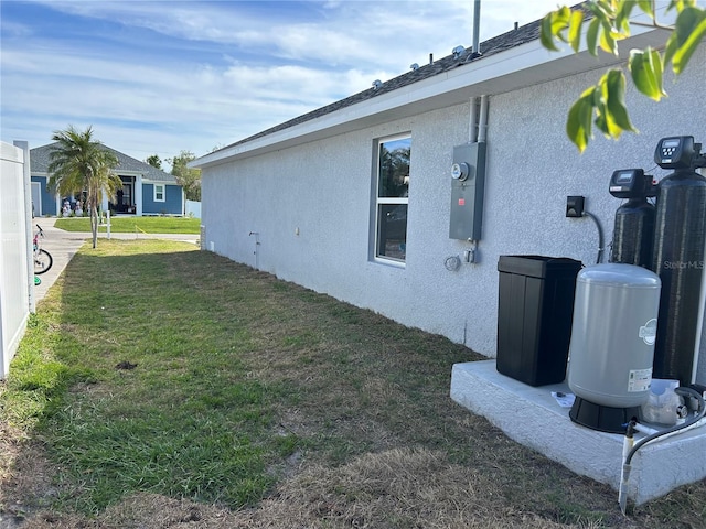 view of home's exterior with a yard