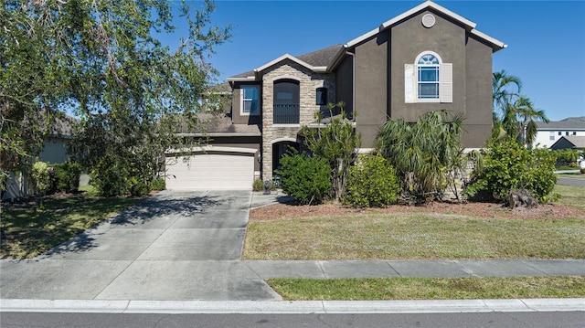 view of front of property with a garage and a front yard