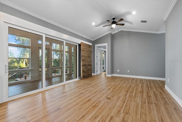 unfurnished room with lofted ceiling, light wood-type flooring, ceiling fan, and ornamental molding