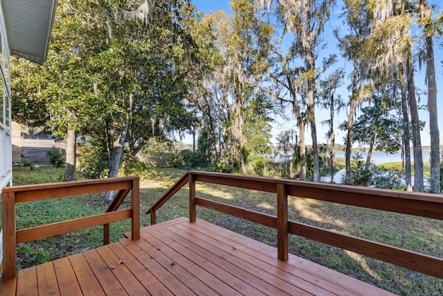 wooden deck with a water view