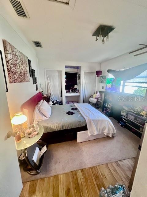 bedroom featuring wood-type flooring