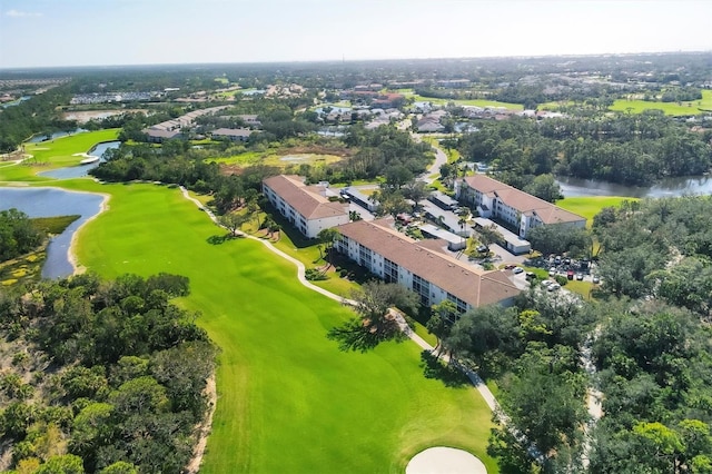 aerial view with a water view and golf course view