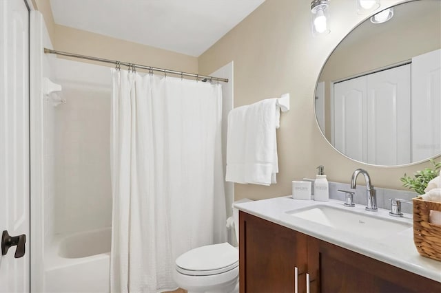 full bath with shower / tub combo, vanity, and toilet