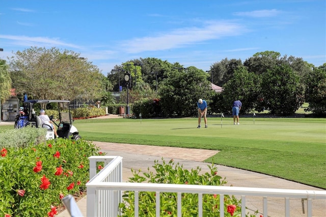 view of property's community with a lawn