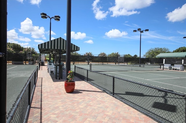 view of tennis court with fence