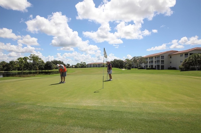 view of community featuring view of golf course and a water view