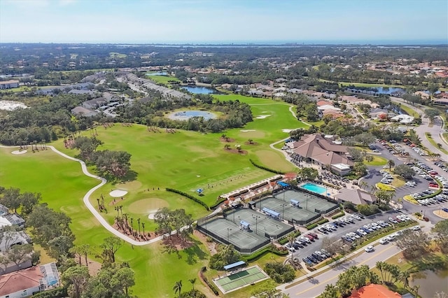 aerial view featuring view of golf course and a water view