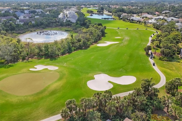 aerial view with a water view, view of golf course, and a residential view