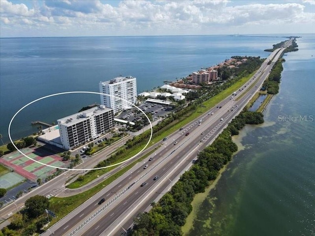 birds eye view of property with a water view