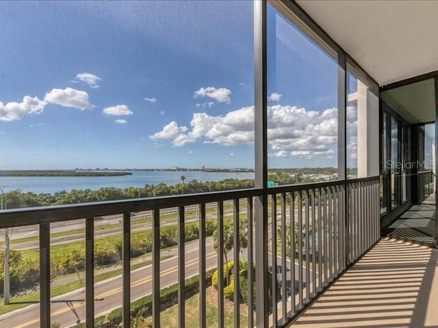 balcony featuring a water view