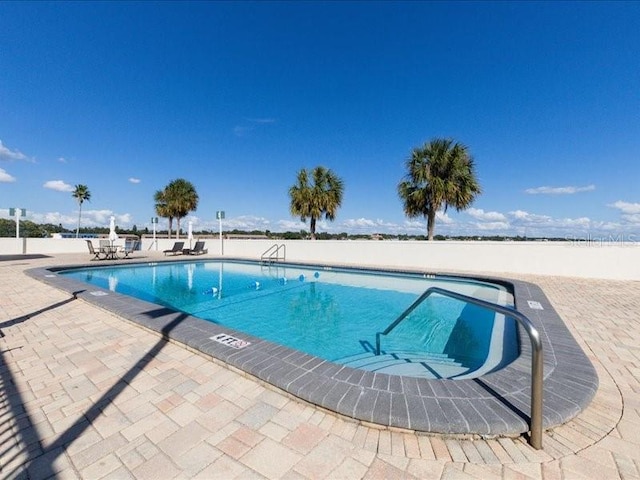 view of swimming pool featuring a patio