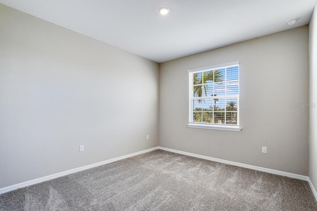 unfurnished room featuring carpet flooring