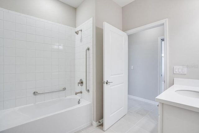 bathroom featuring tile patterned floors, vanity, and tiled shower / bath combo