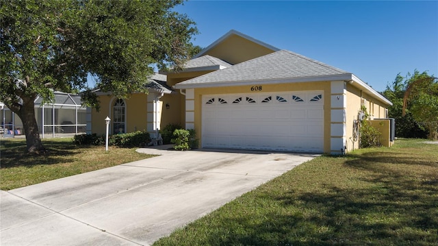 view of front of home featuring a garage, a front lawn, and a lanai