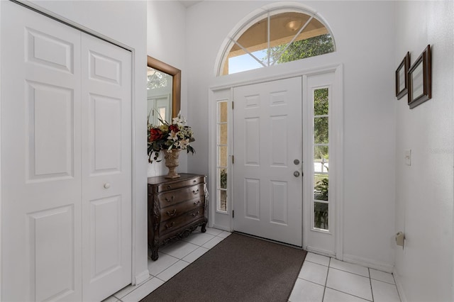 entryway with light tile patterned flooring