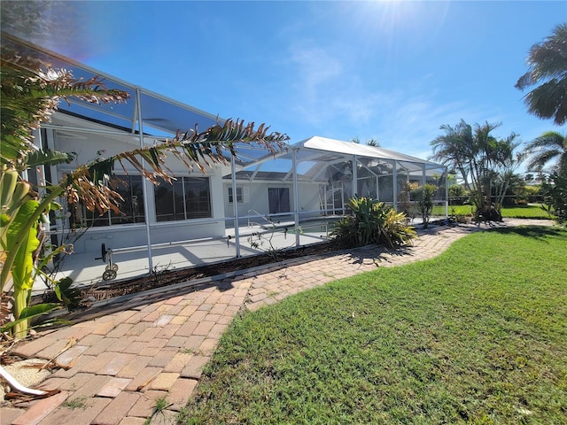 view of yard featuring a lanai and a patio