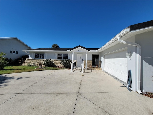 ranch-style house featuring a garage