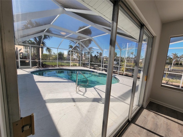 view of pool with a lanai and a patio