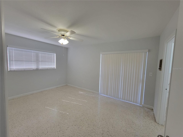 unfurnished room featuring ceiling fan