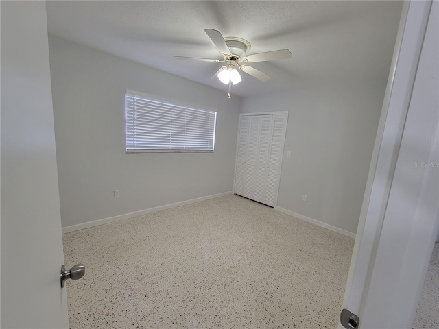 unfurnished room featuring ceiling fan