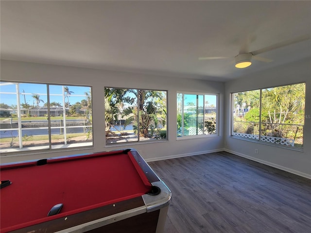 playroom with dark wood-type flooring, ceiling fan, a wealth of natural light, and billiards