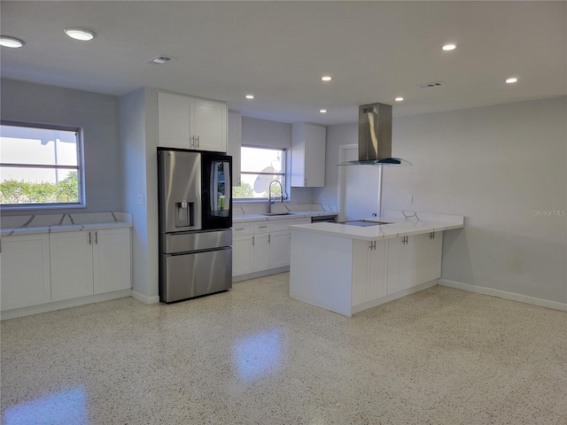 kitchen featuring white cabinetry, sink, stainless steel fridge with ice dispenser, kitchen peninsula, and island range hood