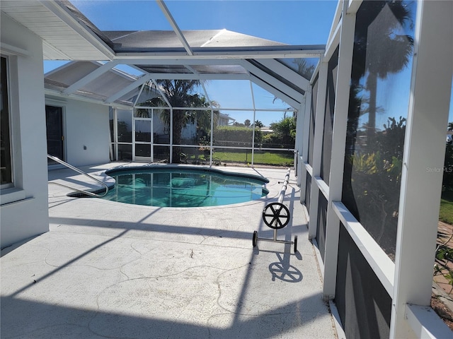 view of pool featuring a lanai and a patio