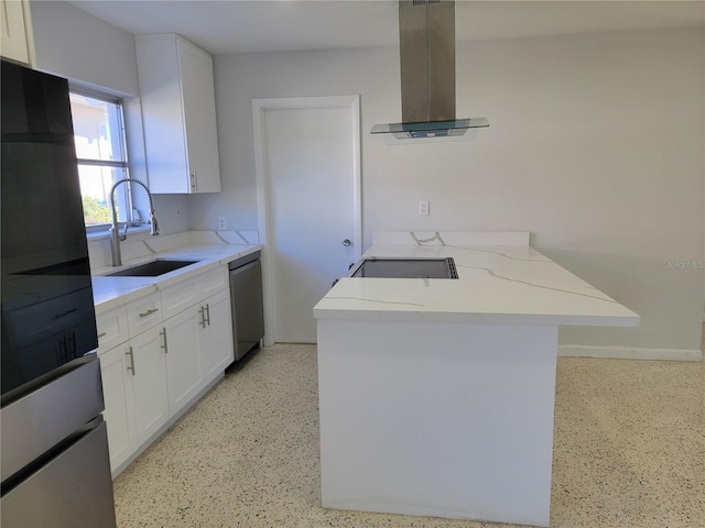 kitchen with white cabinets, appliances with stainless steel finishes, sink, island range hood, and light stone counters