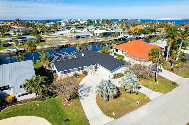 birds eye view of property featuring a water view