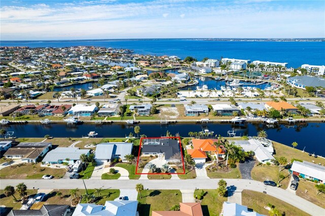 birds eye view of property featuring a water view