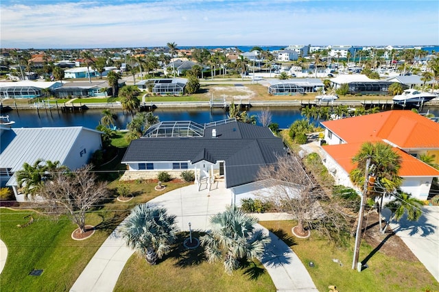 birds eye view of property with a water view