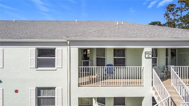 view of front of home with a balcony