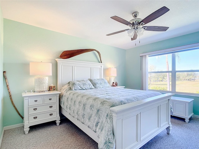 bedroom featuring ceiling fan and light carpet