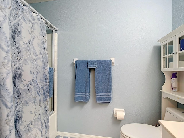 full bathroom featuring shower / bath combo, vanity, and toilet