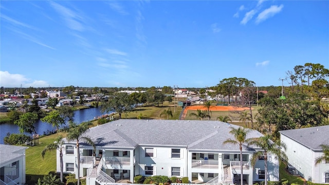 birds eye view of property with a water view