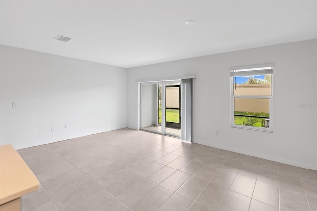 view of tiled spare room