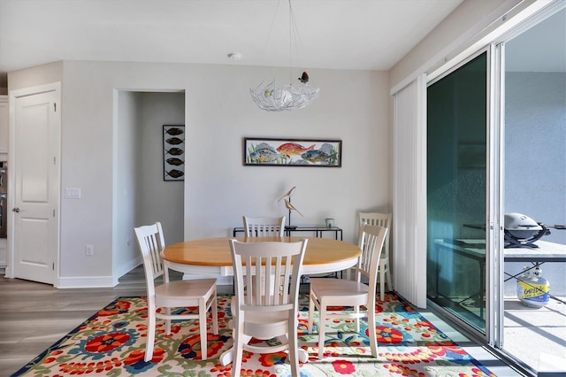 dining area with hardwood / wood-style flooring