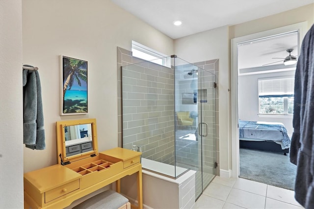 bathroom with ceiling fan, tile patterned floors, and a shower with door