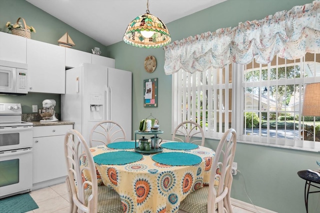 dining area featuring light tile patterned floors