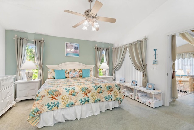 bedroom featuring ceiling fan, vaulted ceiling, and carpet flooring