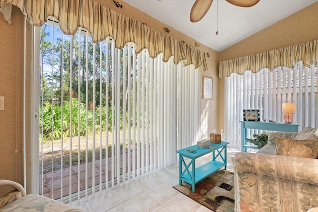 interior space with lofted ceiling and ceiling fan