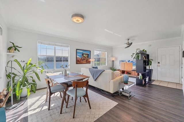 dining space featuring dark hardwood / wood-style floors, ceiling fan, and ornamental molding