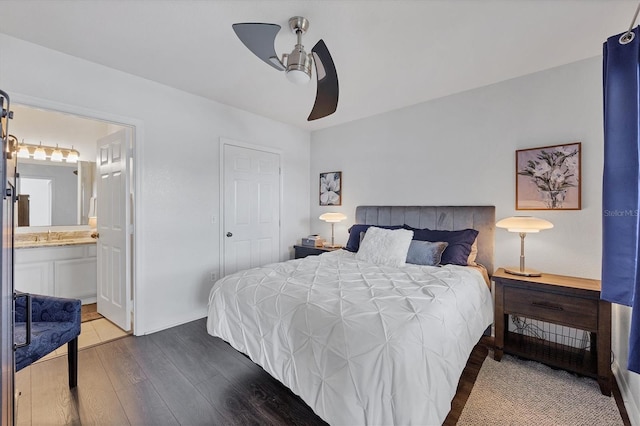 bedroom with ceiling fan, a closet, connected bathroom, and light hardwood / wood-style flooring