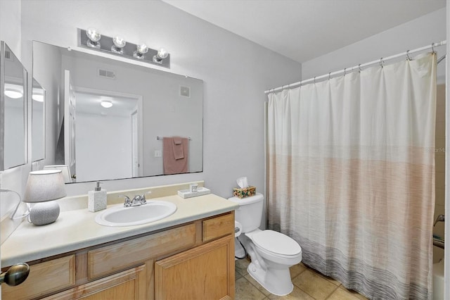 bathroom featuring tile patterned floors, vanity, toilet, and a shower with curtain