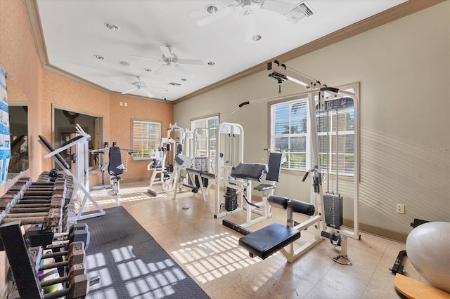 gym featuring ceiling fan and crown molding