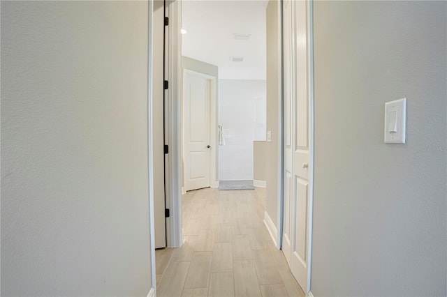 hallway featuring light hardwood / wood-style floors