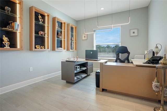 office with wood-type flooring