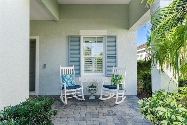 doorway to property featuring a porch